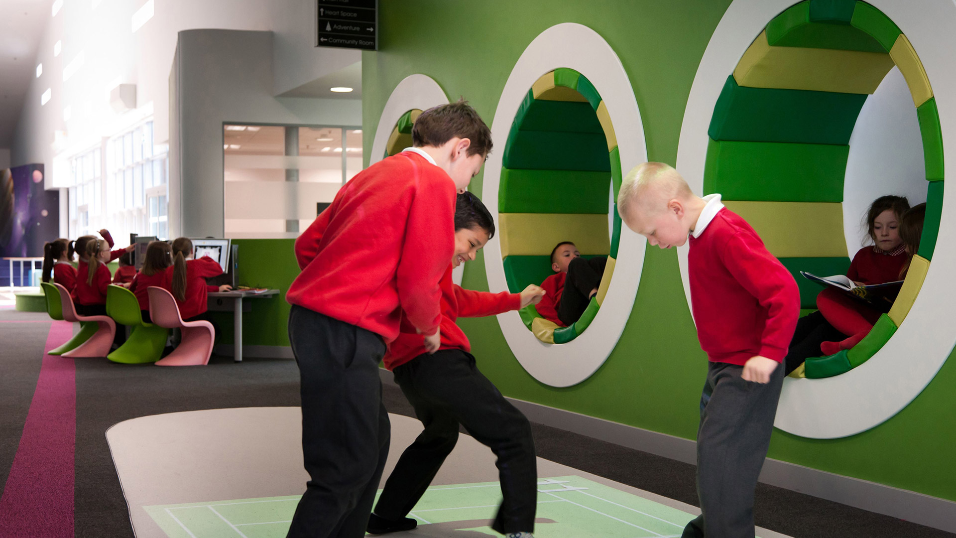 Children playing with an interactive floor game