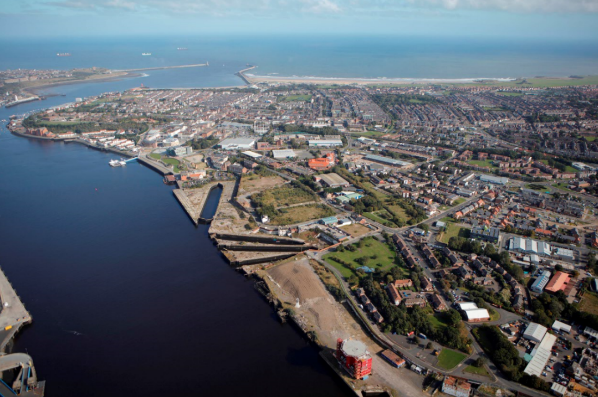 An overhead view of a city and river