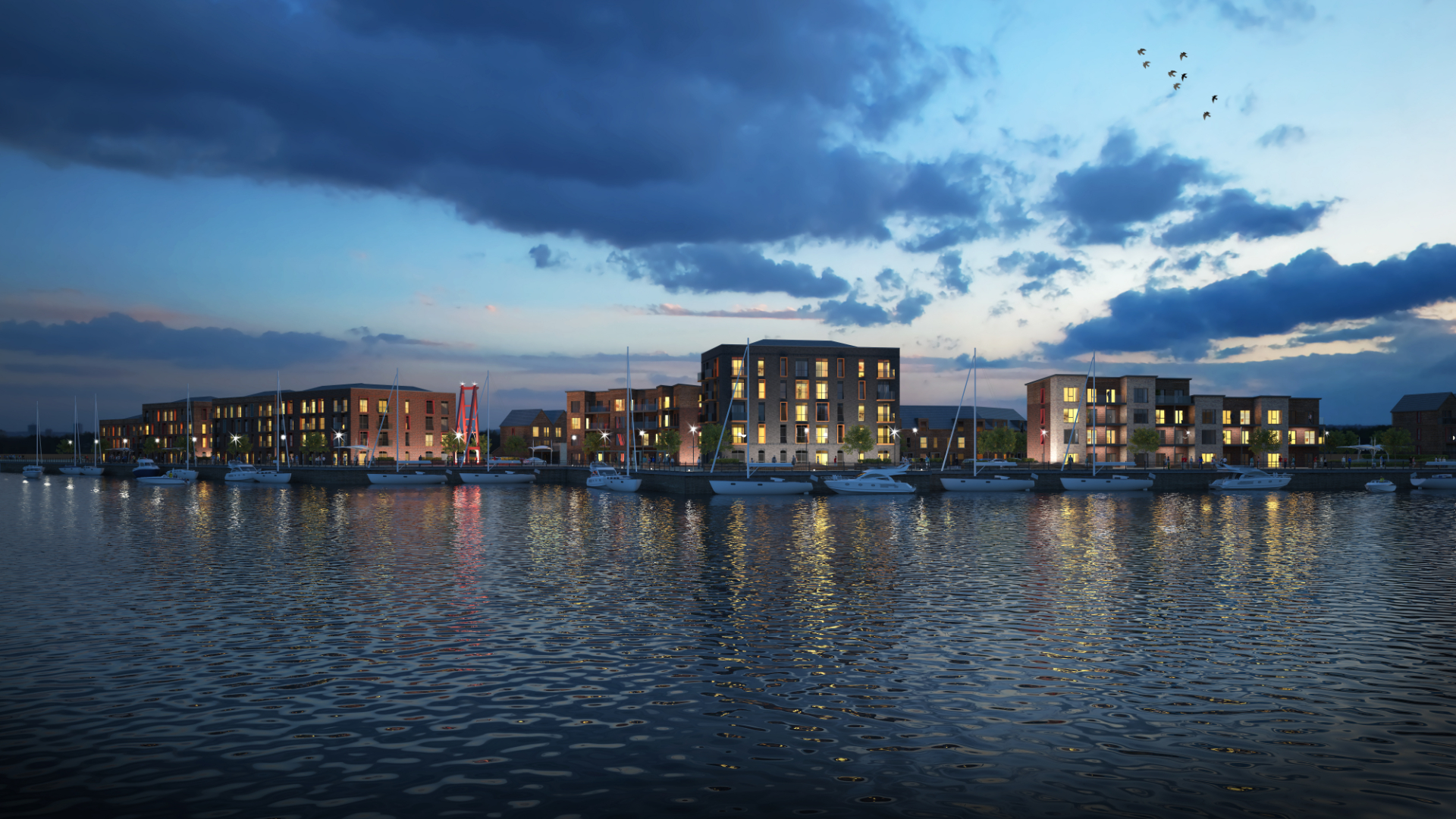 Buildings in south tyneside at dusk along a water front