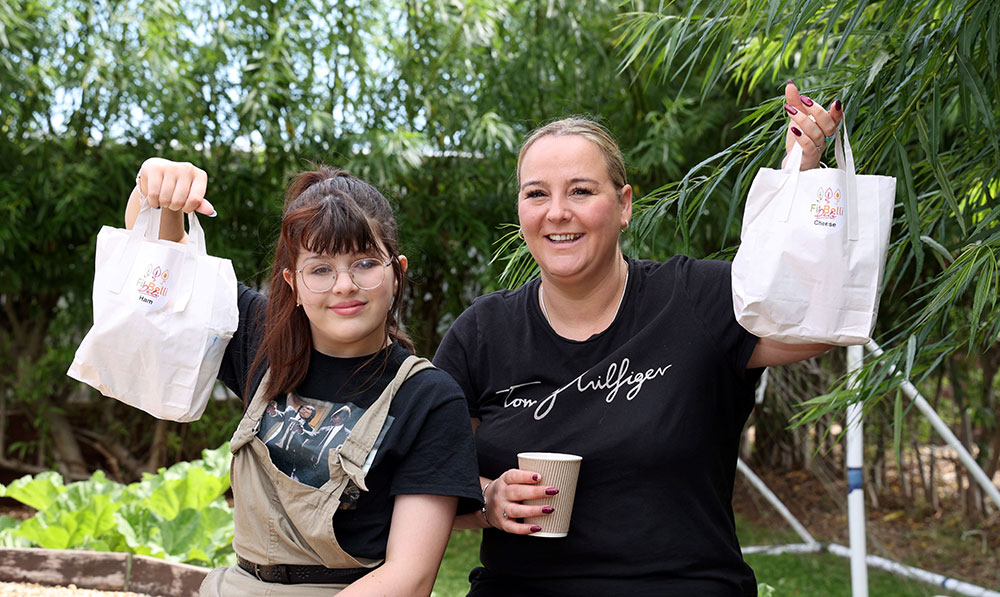 Parent Kelly Warren and her daughter Sky at the Holiday Activities and Food scheme at NECA Gardens