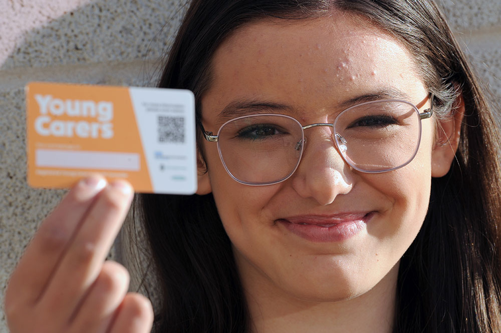 Young carer Charlotte Hamil with the new young carer ID badge
