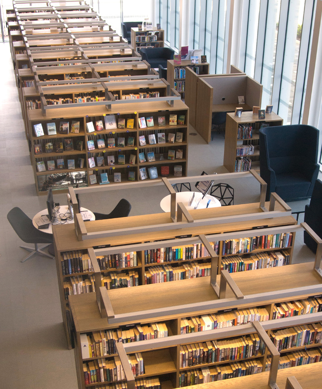 A over head shot of a library showing bookshelves and tables