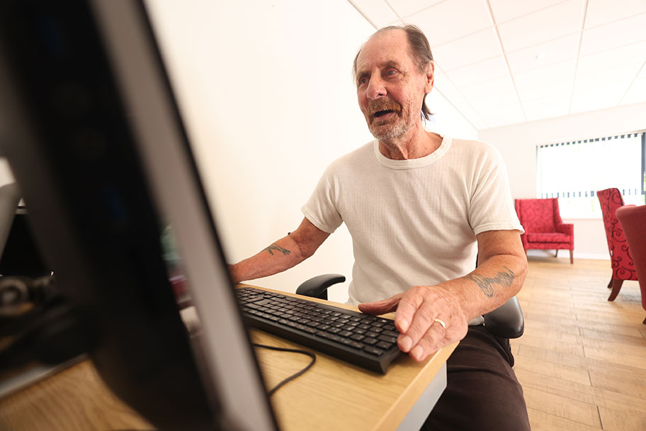 An elderly person using a computer