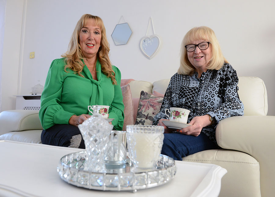 Two people having a cup of tea.